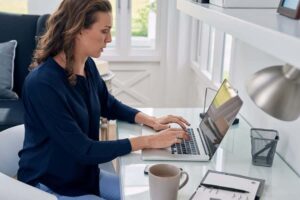 businesswoman entrepreneur working on laptop from home office sp