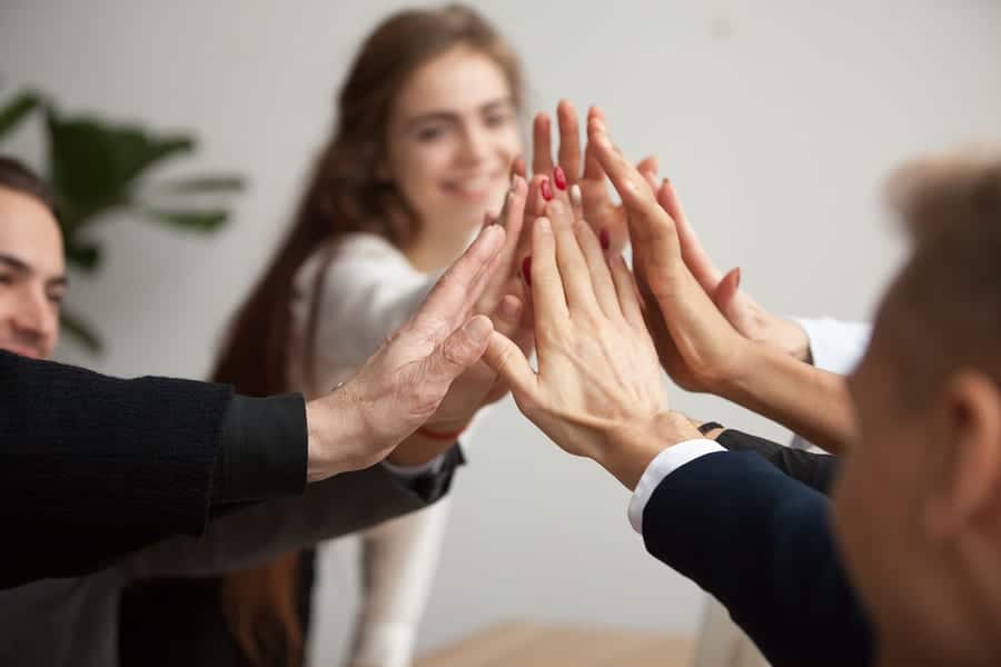 Motivated Successful Business Team Giving High Five